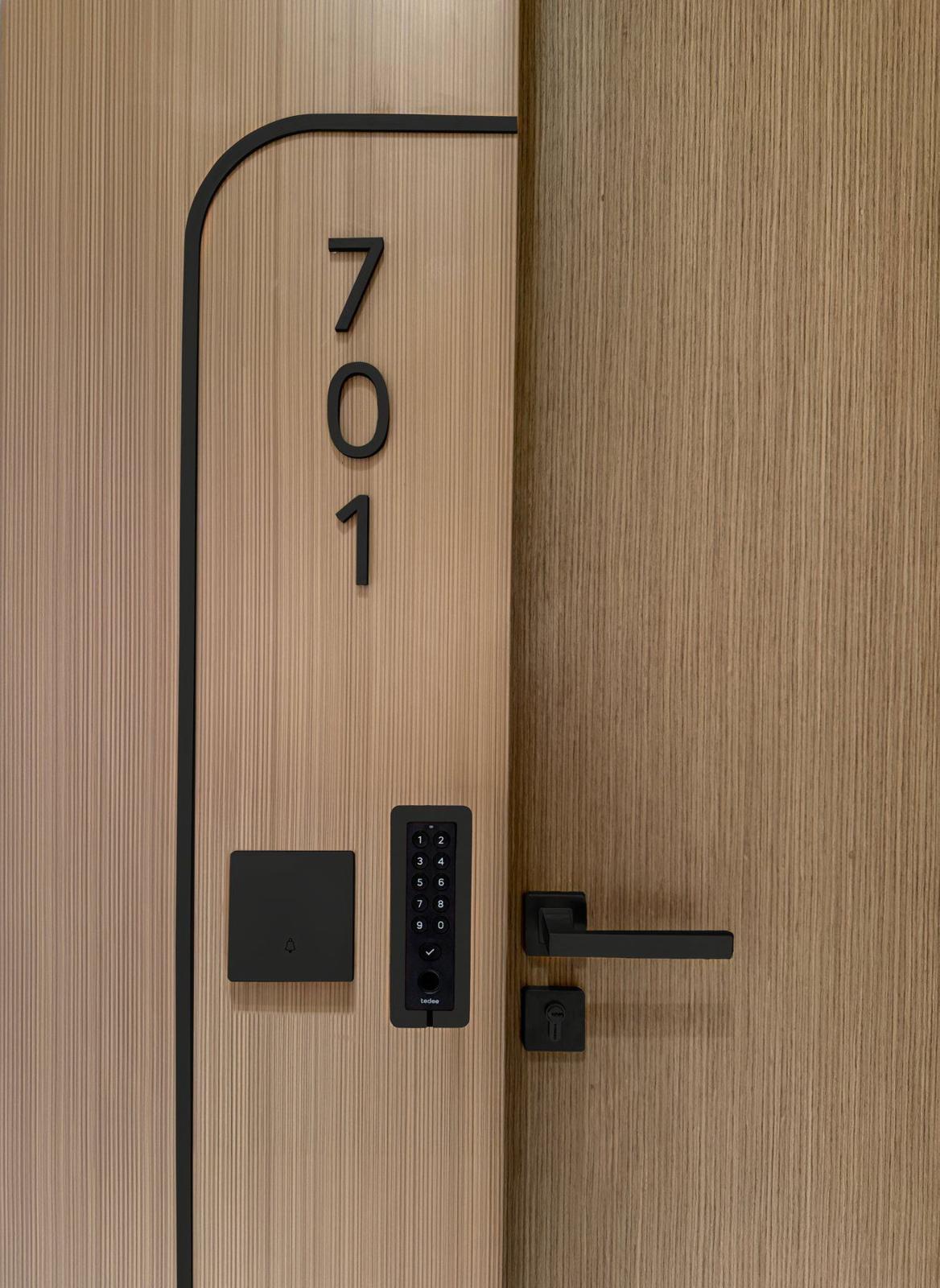 Tedee smart lock and keypad on an apartment door